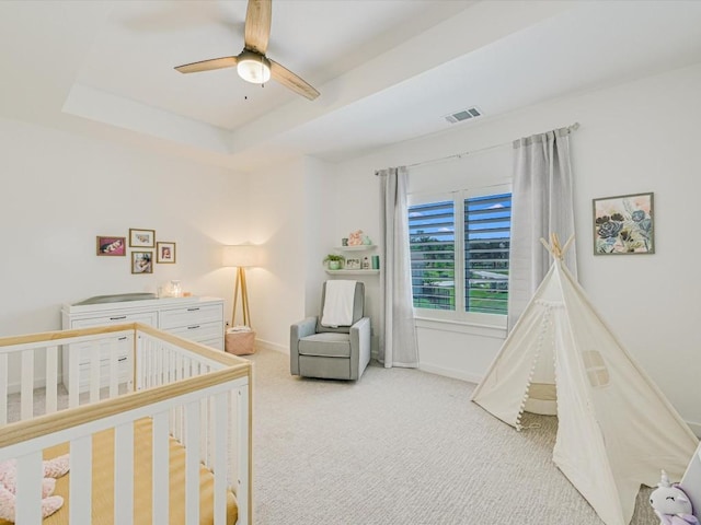 11901 Pier Ct, Austin, TX 78737 - bedroom featuring carpet flooring, a crib, a tray ceiling, and ceiling fan