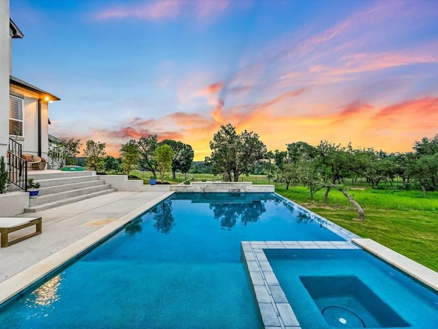 11901 Pier Ct, Austin, TX 78737 - pool at dusk with an in-ground hot tub, a patio area, an outdoor pool, and a yard
