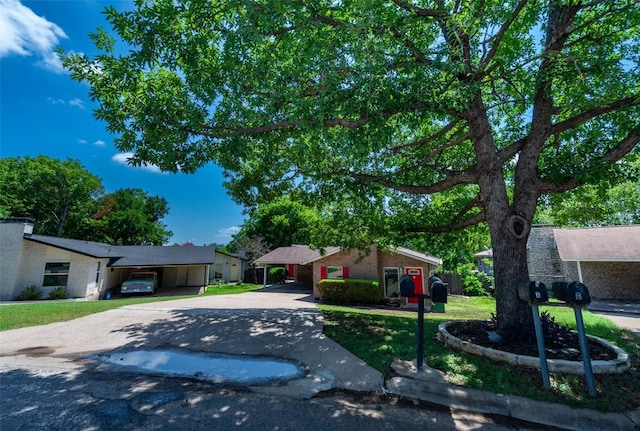7107 Dan Jean Dr Unit A & B, Austin, TX 78745 - view of front of home with driveway, a carport, and a front yard