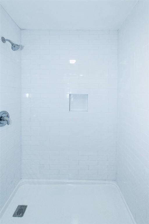 7107 Dan Jean Dr Unit A & B, Austin, TX 78745 - bathroom featuring a tile shower