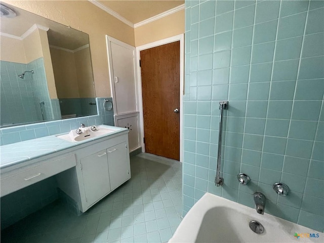 601 S Arnold St S, Lampasas, TX 76550 - bathroom with crown molding, tile patterned floors, vanity, and tile walls