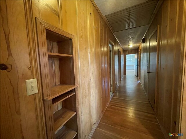 601 S Arnold St S, Lampasas, TX 76550 - hall featuring wood finished floors and wooden walls