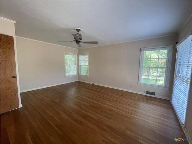 601 S Arnold St S, Lampasas, TX 76550 - spare room featuring ornamental molding, dark wood-style flooring, and a ceiling fan