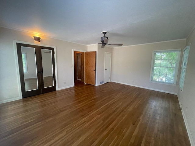 601 S Arnold St S, Lampasas, TX 76550 - spare room featuring french doors, dark wood-style flooring, ornamental molding, and a ceiling fan
