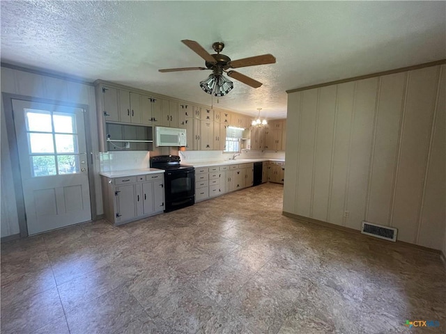 601 S Arnold St S, Lampasas, TX 76550 - kitchen featuring black appliances, a chandelier, a ceiling fan, a textured ceiling, and light countertops