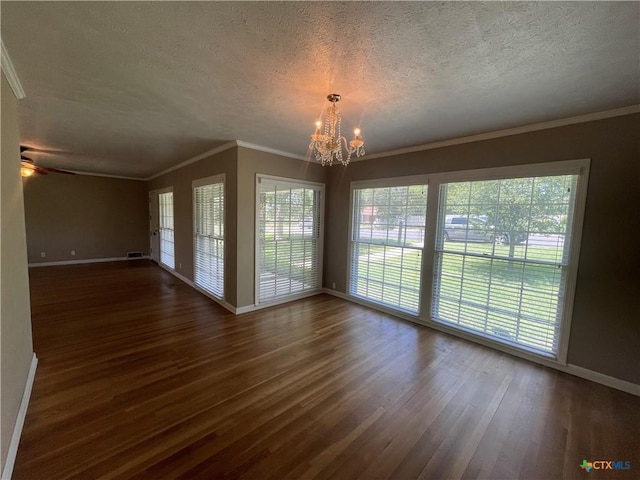 601 S Arnold St S, Lampasas, TX 76550 - spare room featuring a chandelier, a textured ceiling, dark wood-style flooring, crown molding, and a ceiling fan