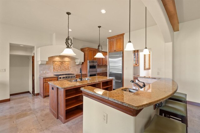 307 Goodnight Dr, Georgetown, TX 78628 - kitchen with appliances with stainless steel finishes, brown cabinets, open shelves, an island with sink, and tasteful backsplash