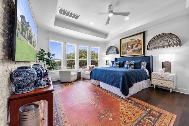 203 Black Stone Cv, Driftwood, TX 78619 - bedroom featuring ornamental molding, a raised ceiling, wood finished floors, recessed lighting, and ceiling fan