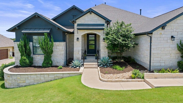 203 Black Stone Cv, Driftwood, TX 78619 - french country inspired facade featuring stone siding, roof with shingles, and a front lawn