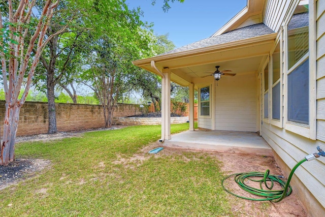 9728 Alex Ln, Austin, TX 78748 - fenced backyard with ceiling fan and a patio
