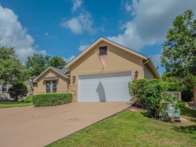 100 N Meadowlark St, Lakeway, TX 78734 - ranch-style house with driveway, a garage, stucco siding, a front lawn, and stone siding
