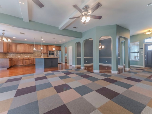 100 N Meadowlark St, Lakeway, TX 78734 - unfurnished living room with ceiling fan, arched walkways, beamed ceiling, recessed lighting, and a chandelier