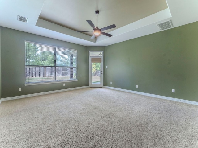 100 N Meadowlark St, Lakeway, TX 78734 - carpeted empty room featuring a raised ceiling and ceiling fan