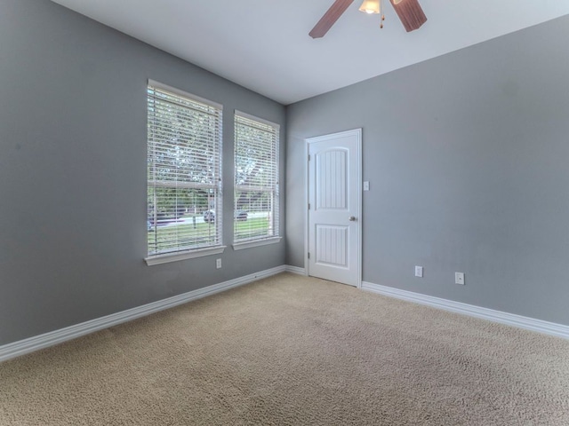 100 N Meadowlark St, Lakeway, TX 78734 - empty room featuring healthy amount of natural light, a ceiling fan, and light carpet