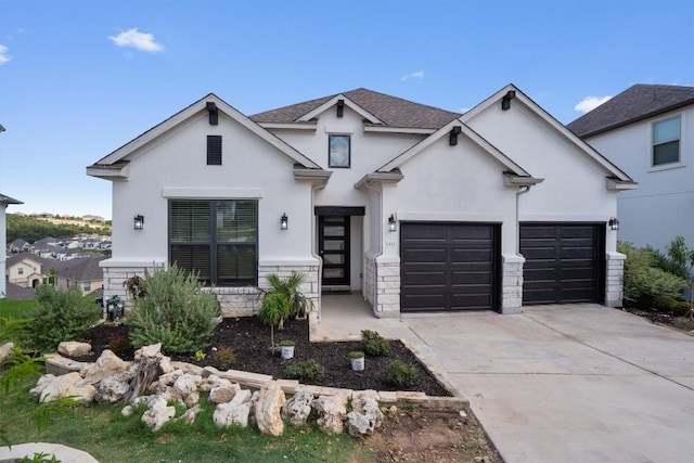 1332 Al Fresco Cv, Leander, TX 78641 - view of front of house featuring stucco siding, stone siding, and concrete driveway