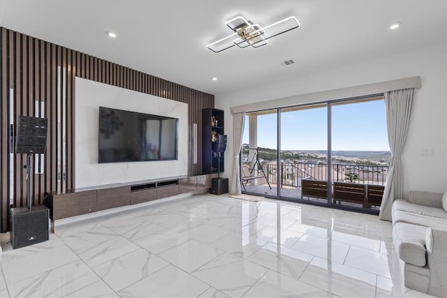 1332 Al Fresco Cv, Leander, TX 78641 - unfurnished living room featuring marble finish floors and recessed lighting