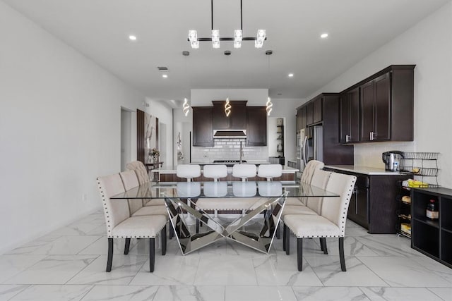 1332 Al Fresco Cv, Leander, TX 78641 - dining area with light marble finish floors and recessed lighting