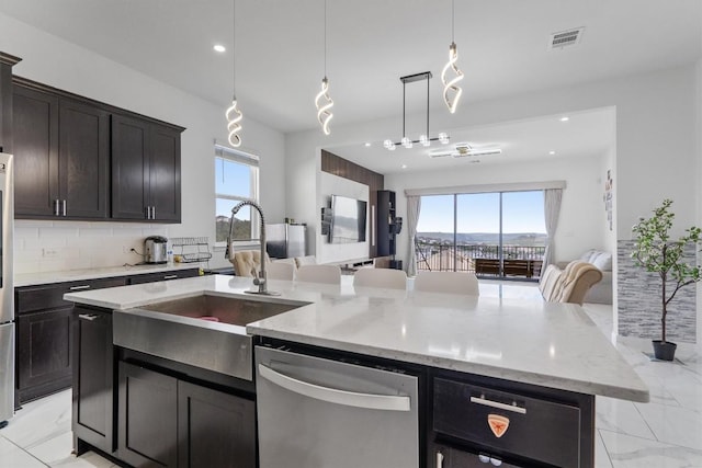 1332 Al Fresco Cv, Leander, TX 78641 - kitchen with dishwasher, healthy amount of natural light, open floor plan, decorative backsplash, and recessed lighting