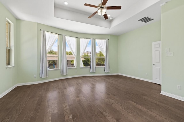 2708 Feathergrass Ct, Cedar Park, TX 78613 - spare room with a ceiling fan, dark wood finished floors, a tray ceiling, and recessed lighting