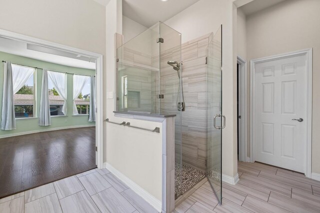 2708 Feathergrass Ct, Cedar Park, TX 78613 - bathroom featuring a stall shower and wood finished floors
