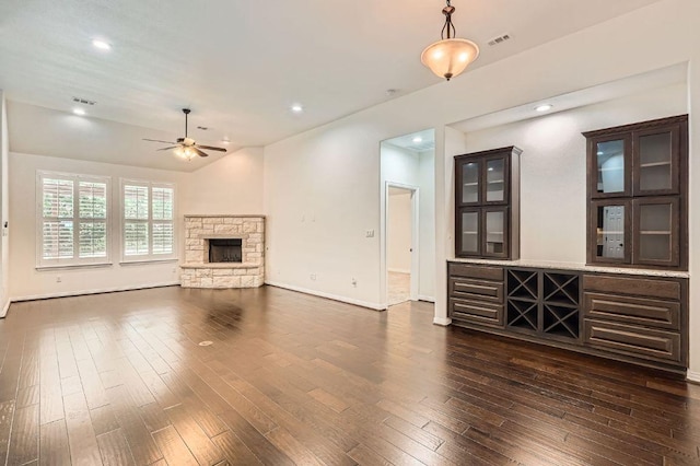 851 Catalina Ln, Austin, TX 78737 - unfurnished living room featuring ceiling fan, a fireplace, dark wood-style floors, lofted ceiling, and recessed lighting