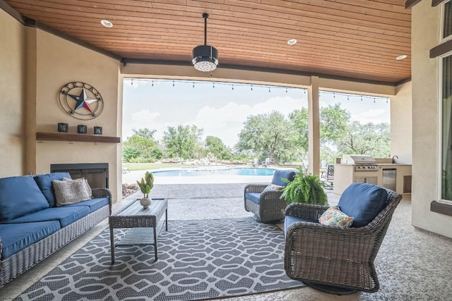213 Woodland Hills Dr, Georgetown, TX 78633 - view of patio with an outdoor living space with a fireplace, an outdoor pool, and exterior kitchen