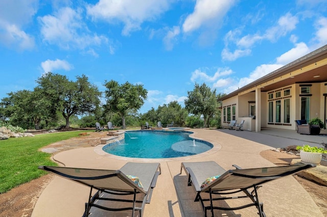 213 Woodland Hills Dr, Georgetown, TX 78633 - view of swimming pool featuring a patio, a pool with connected hot tub, and a lawn
