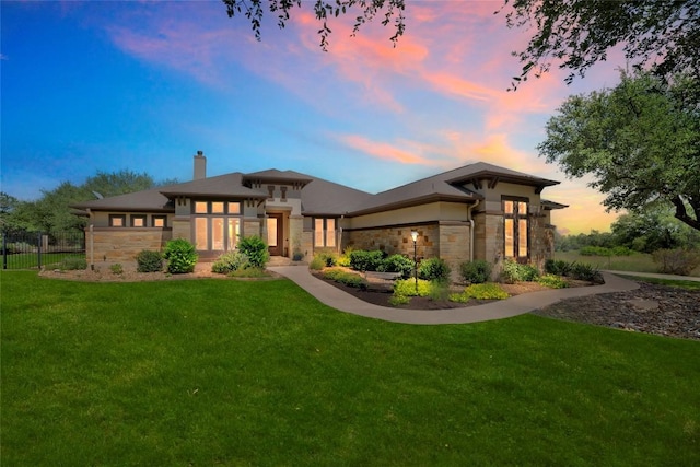 213 Woodland Hills Dr, Georgetown, TX 78633 - back of property at dusk featuring stone siding and a chimney