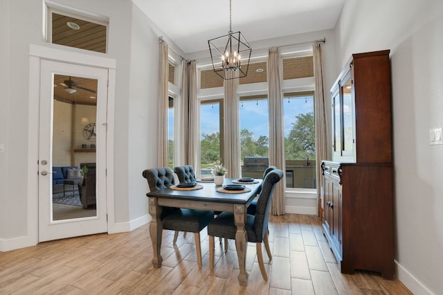 213 Woodland Hills Dr, Georgetown, TX 78633 - dining room with a chandelier and light wood finished floors