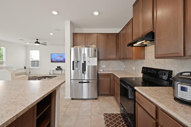 538 Thunder Valley Trl, Georgetown, TX 78626 - kitchen with stainless steel fridge with ice dispenser, black electric range, under cabinet range hood, light tile patterned floors, and decorative backsplash
