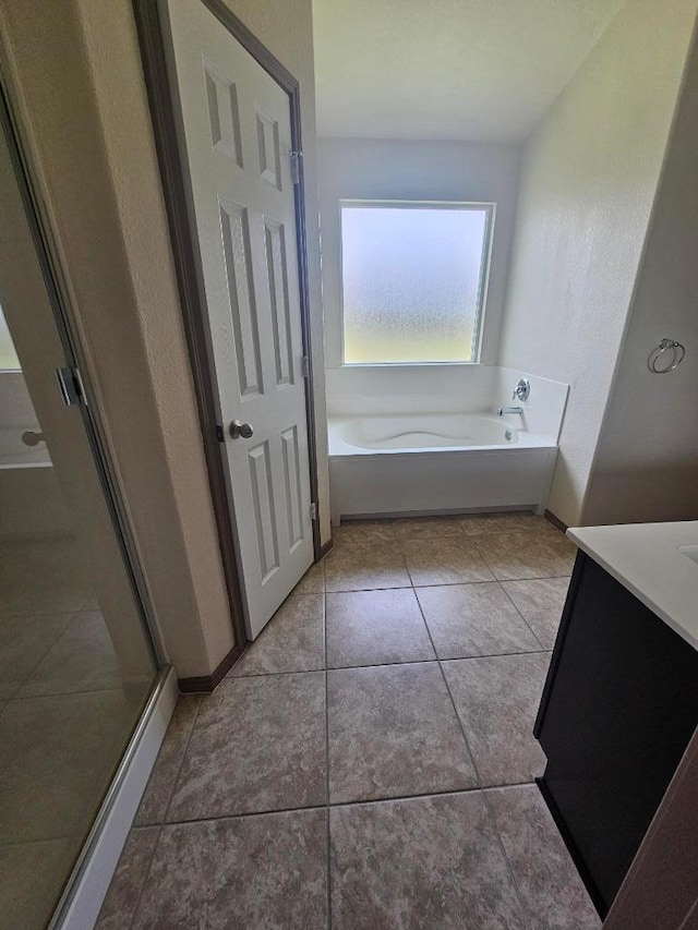 9405 Glynhill Ct, Killeen, TX 76542 - bathroom with a bath, a shower stall, vanity, and tile patterned flooring