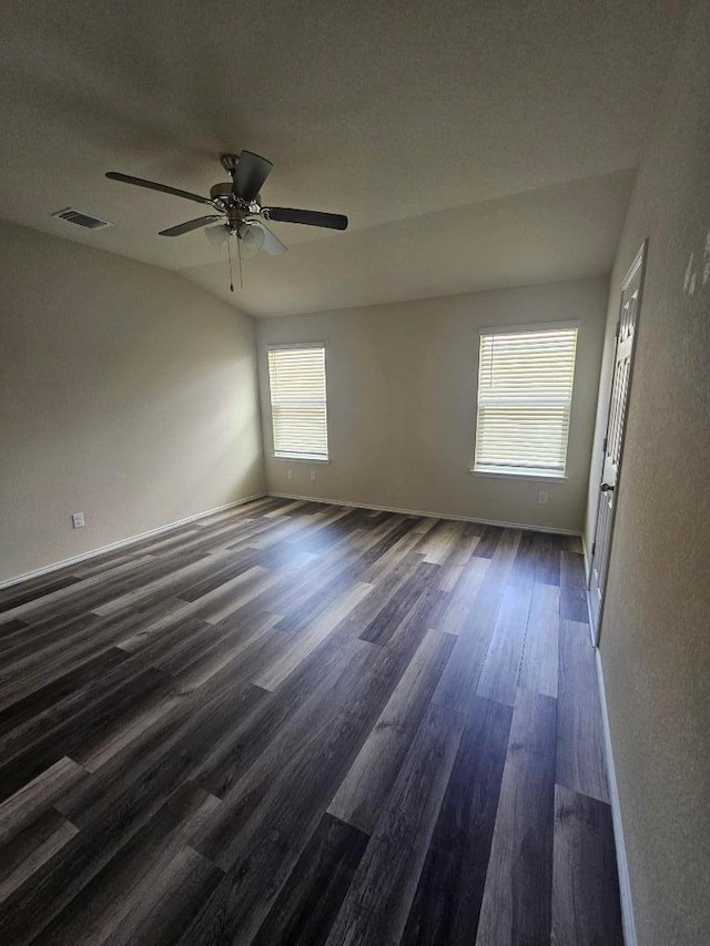 9405 Glynhill Ct, Killeen, TX 76542 - spare room with dark wood-type flooring, healthy amount of natural light, and ceiling fan
