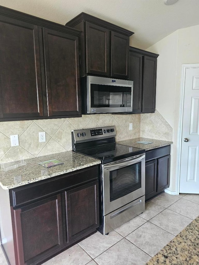 9405 Glynhill Ct, Killeen, TX 76542 - kitchen featuring stainless steel appliances, light stone counters, and backsplash