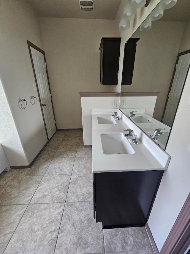 9405 Glynhill Ct, Killeen, TX 76542 - bathroom with double vanity and tile patterned floors