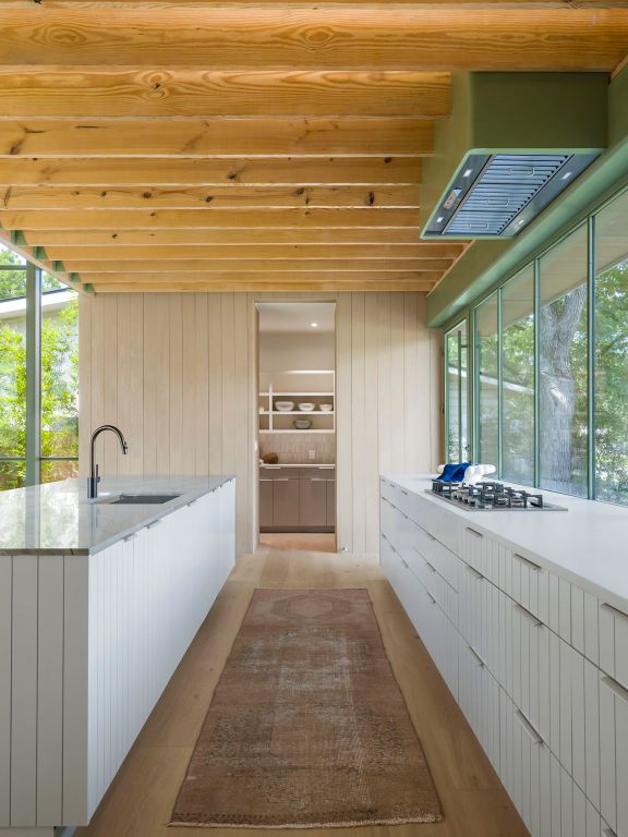 4506 Chiappero Trl, Austin, TX 78731 - bathroom featuring wood finished floors, healthy amount of natural light, and wood walls