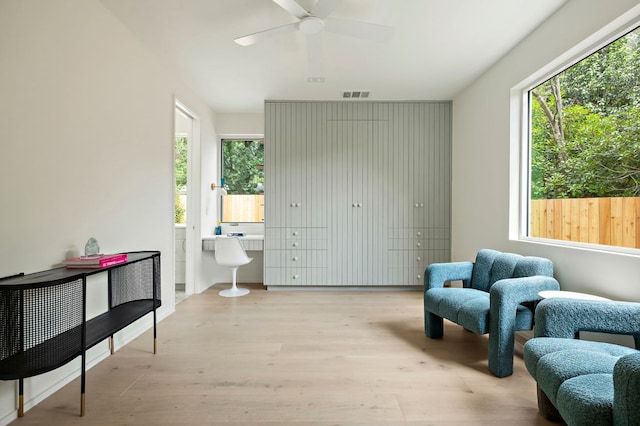 4506 Chiappero Trl, Austin, TX 78731 - sitting room with healthy amount of natural light, wood finished floors, and a ceiling fan