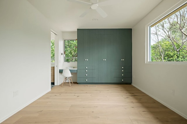 4506 Chiappero Trl, Austin, TX 78731 - unfurnished bedroom with wood finished floors and baseboards