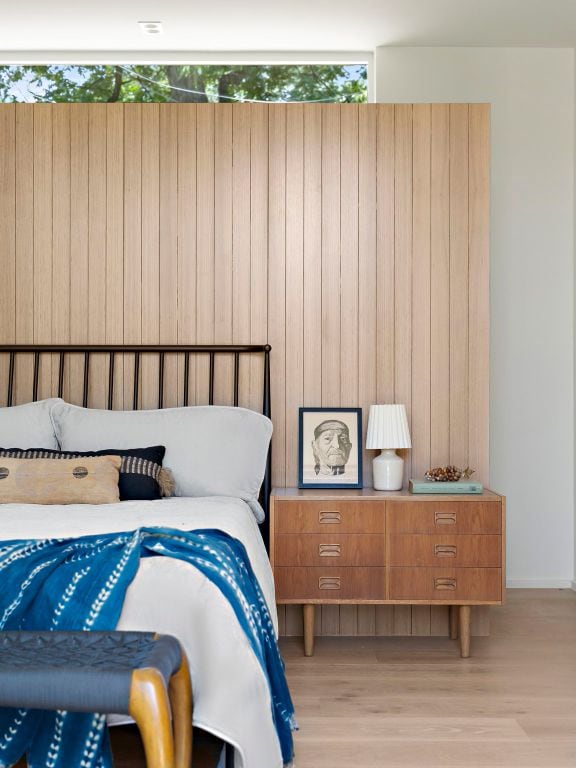 4506 Chiappero Trl, Austin, TX 78731 - bedroom featuring light wood-style floors and wood walls