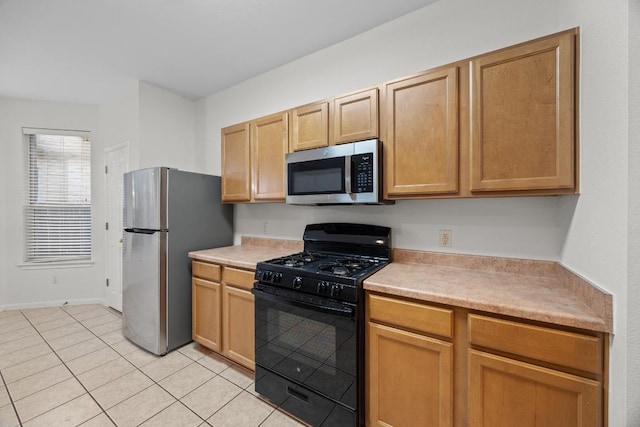 716 Bent Wood Pl, Round Rock, TX 78665 - kitchen with stainless steel appliances, light countertops, and light tile patterned floors