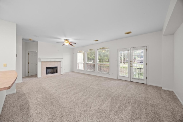716 Bent Wood Pl, Round Rock, TX 78665 - unfurnished living room featuring ceiling fan, carpet flooring, plenty of natural light, and a fireplace