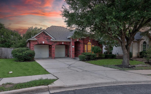 716 Bent Wood Pl, Round Rock, TX 78665 - view of front facade featuring brick siding, a lawn, a garage, and driveway