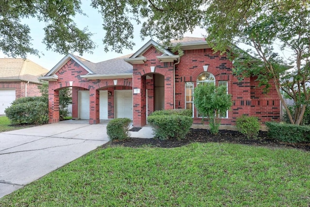 716 Bent Wood Pl, Round Rock, TX 78665 - view of front of property featuring brick siding, concrete driveway, a front lawn, and an attached garage