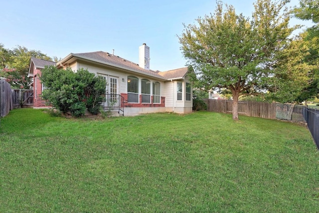 716 Bent Wood Pl, Round Rock, TX 78665 - back of property featuring a fenced backyard and a chimney