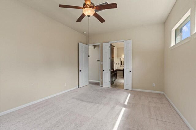 100 Calima Cv, Round Rock, TX 78681 - unfurnished bedroom featuring light carpet, ensuite bath, and a ceiling fan