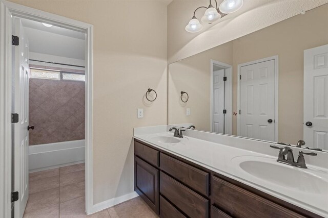 100 Calima Cv, Round Rock, TX 78681 - full bathroom featuring double vanity, tile patterned floors, and bathing tub / shower combination