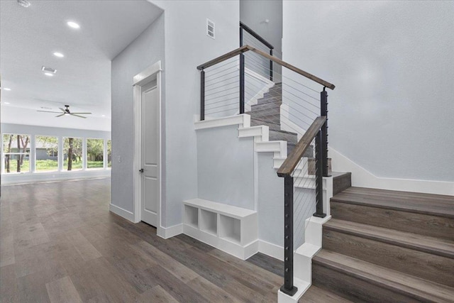 103 W Pauwela Ln, Bastrop, TX 78602 - stairs with recessed lighting, a ceiling fan, and wood finished floors
