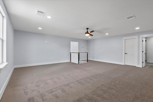 103 W Pauwela Ln, Bastrop, TX 78602 - empty room featuring carpet, ceiling fan, and recessed lighting