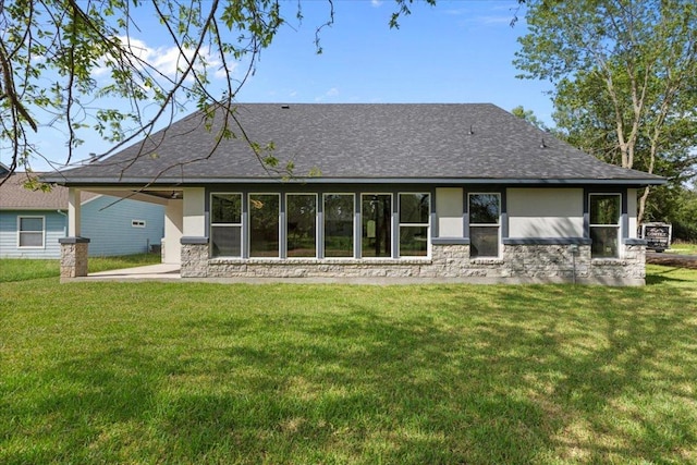 103 W Pauwela Ln, Bastrop, TX 78602 - rear view of house with a lawn, a shingled roof, and a patio