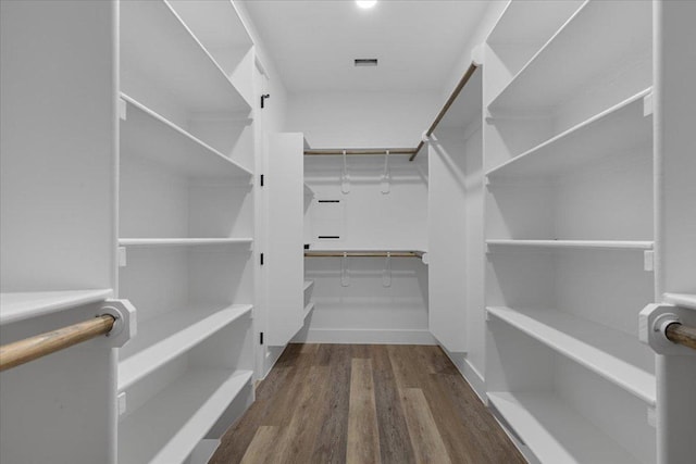 103 W Pauwela Ln, Bastrop, TX 78602 - spacious closet featuring wood finished floors