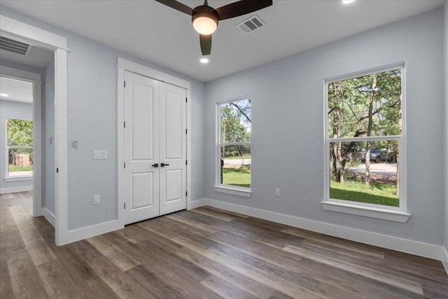 103 W Pauwela Ln, Bastrop, TX 78602 - unfurnished bedroom with dark wood-type flooring, recessed lighting, a closet, and ceiling fan